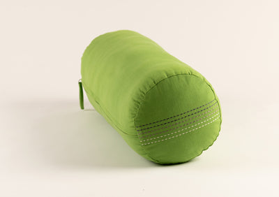 Green yoga bolster with lavender stripes on the side.